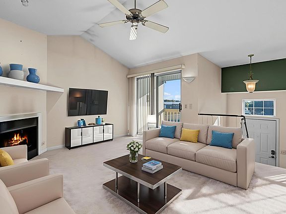 Living room with gas fireplace and balcony!