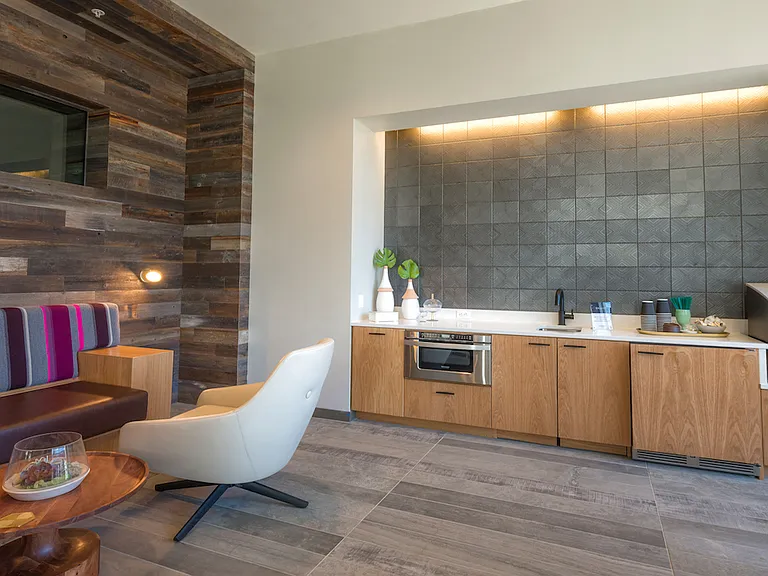 Lounge with built-in seating and kitchenette for casual gatherings.