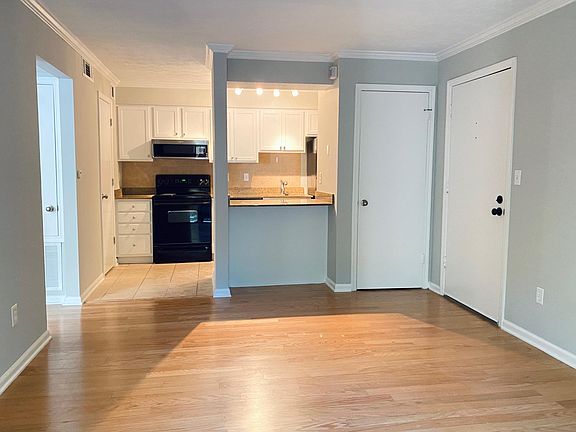 Hardwood floors, fresh paint on walls and cabinets. Entrance closet with plenty of space.