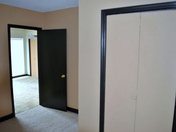 Same bedroom, different view to living room/dining room