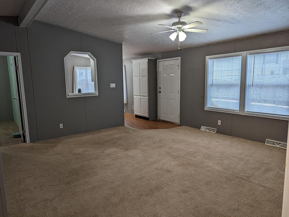 Open concept living room with cathedral ceilings