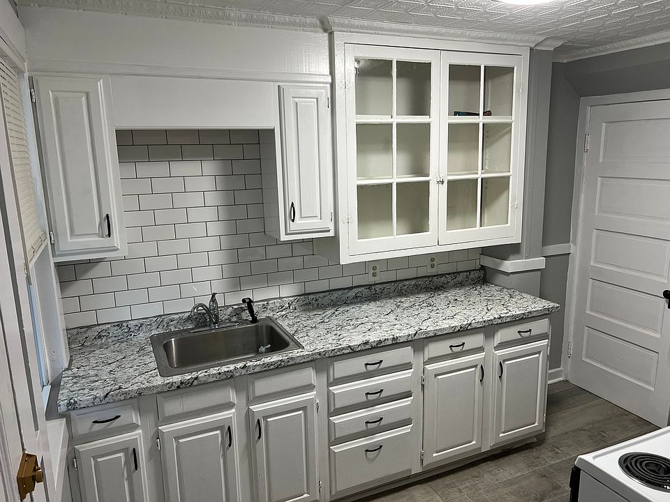 Kitchen: new countertop, backsplash, and flooring