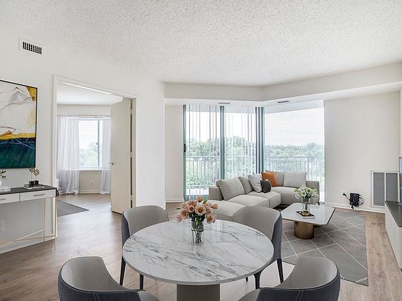 Renovated Package II dining and living room with hard surface flooring