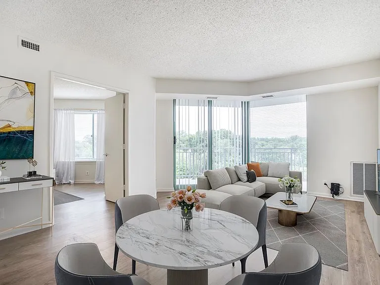 Renovated Package II dining and living room with hard surface flooring
