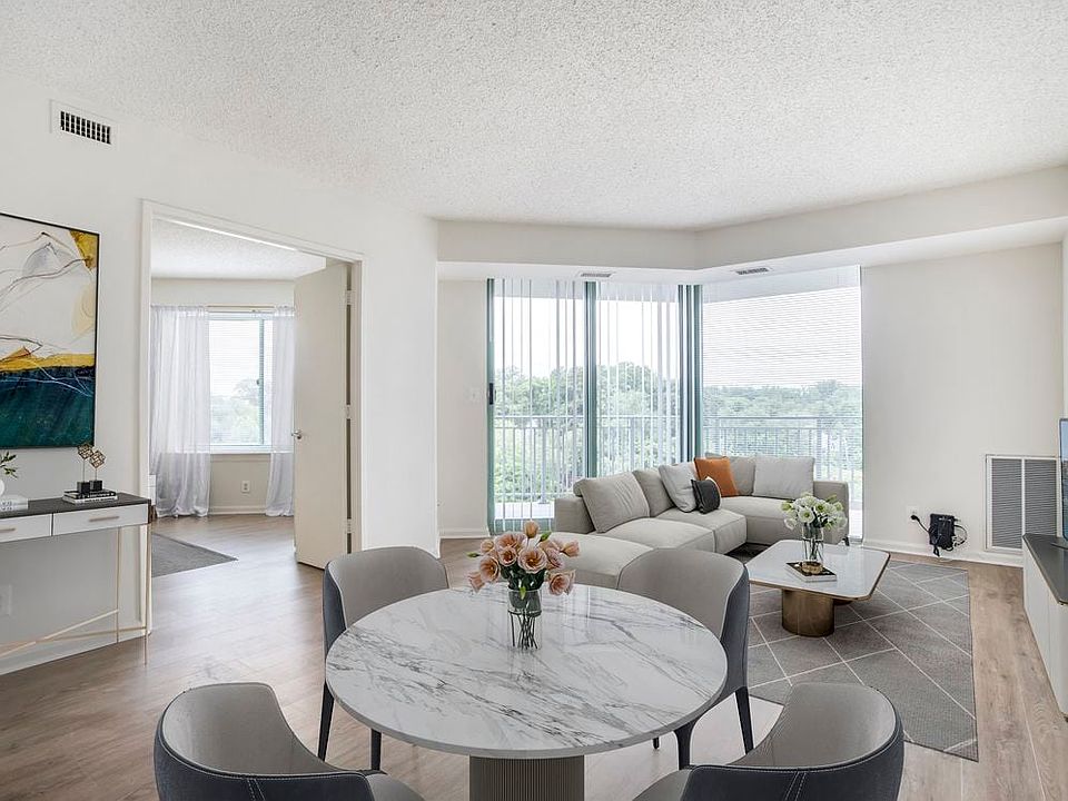 Renovated Package II dining and living room with hard surface flooring