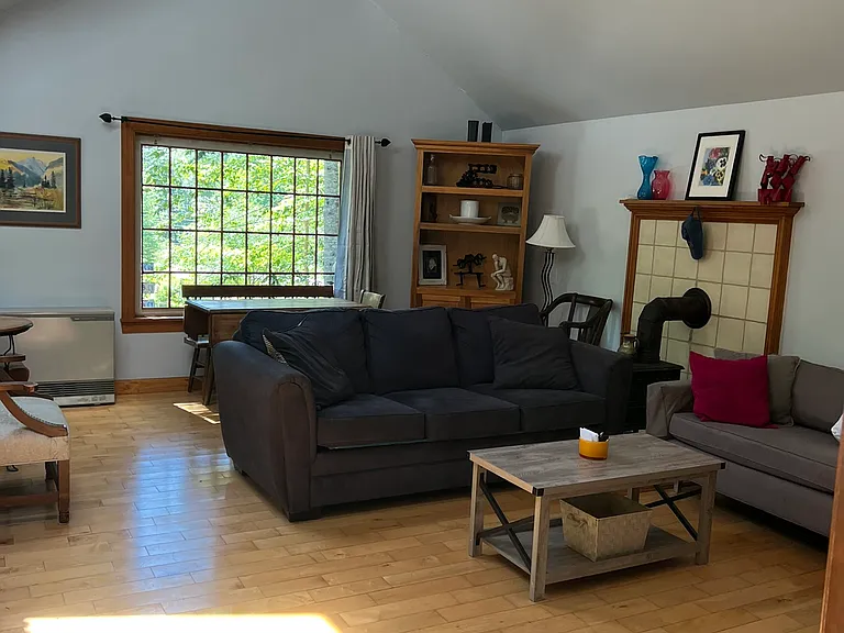 Lots of light and wooded views from the living room.