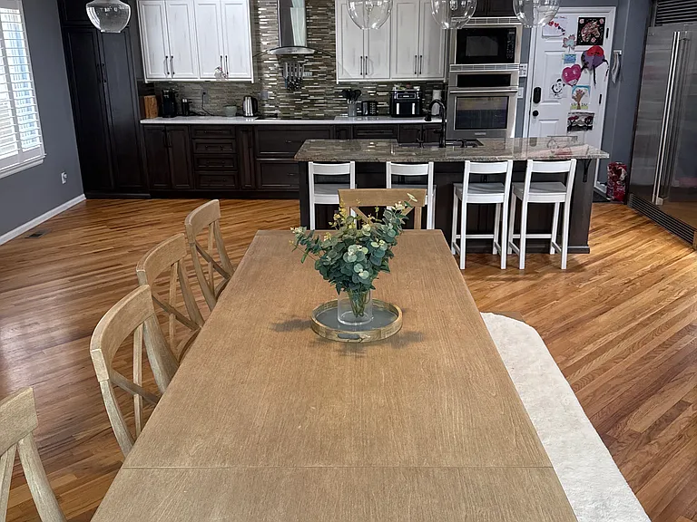Custom built kitchen cabinets with large soft-close drawers throughout. Not pictured is a custom built-in liquor cabinet and media center.