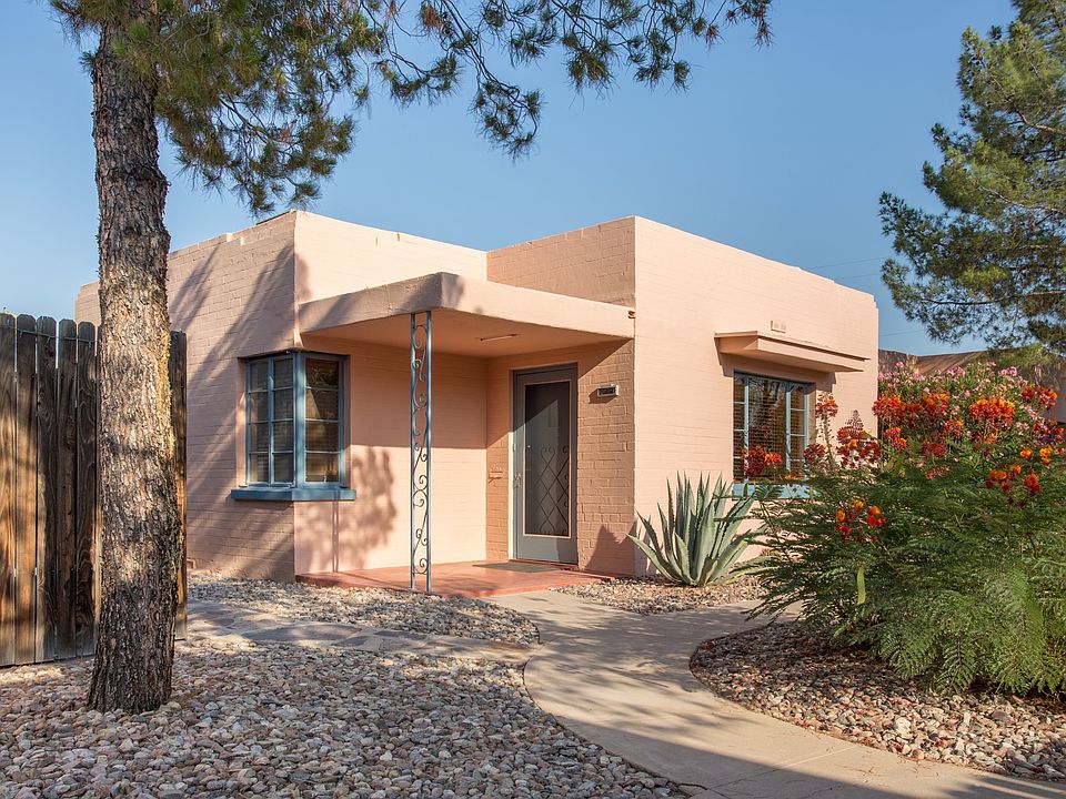 Beautiful cottage exterior on landscaped grounds.
