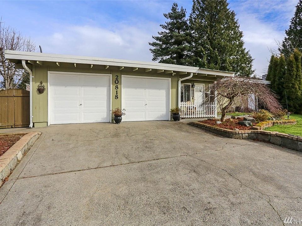 Welcome home to this sweetheart rambler located on a quiet cul-de-sac featuring 3 bedrooms and 2 bathrooms. The adorable private courtyard entry provides charming curb appeal. Enter to the spacious living room with gleaming hardwood flooring and a wood-burning fireplace for those chilly nights. Newer craftsman style doors, white painted millwork and newer double pane windows gives this home a Northwest flair. The kitchen will delight you with Corian counters, glass mosaic backsplash, stainless steel appliances, laminate floors, plenty of cabinets, a great gathering space with an eat-in dining area and natural light. From here you can extend your entertaining outside to the spacious deck, fire-pit, beautiful gardens beds, shed and fully fenced yard. This home offers a light and bright family room off the kitchen with newer carpets, brick accent wall and access to the backyard.