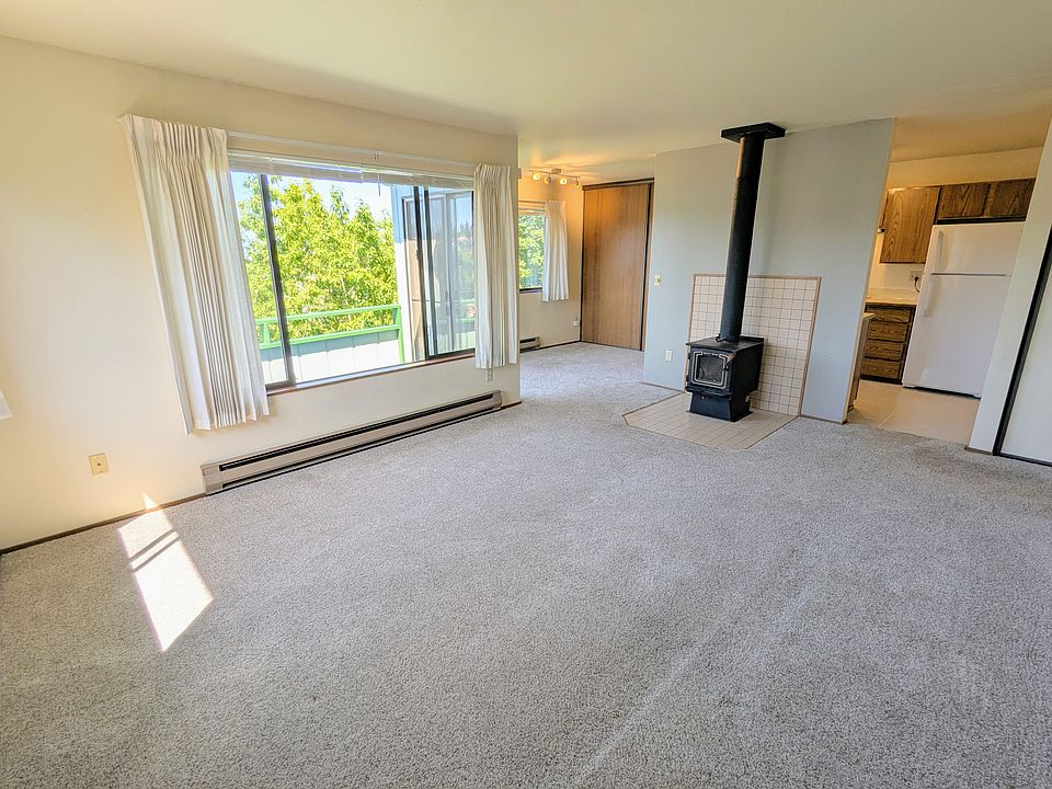 Living room, office/dining area, and view into kitchen