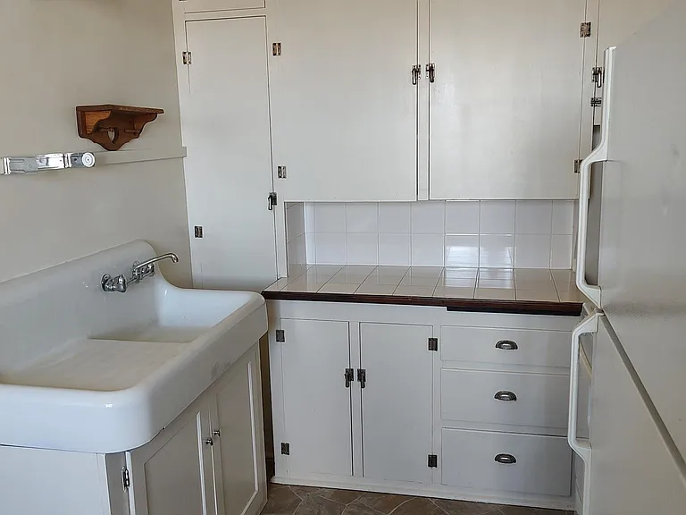 Kitchen with full size appliances and farm sink.