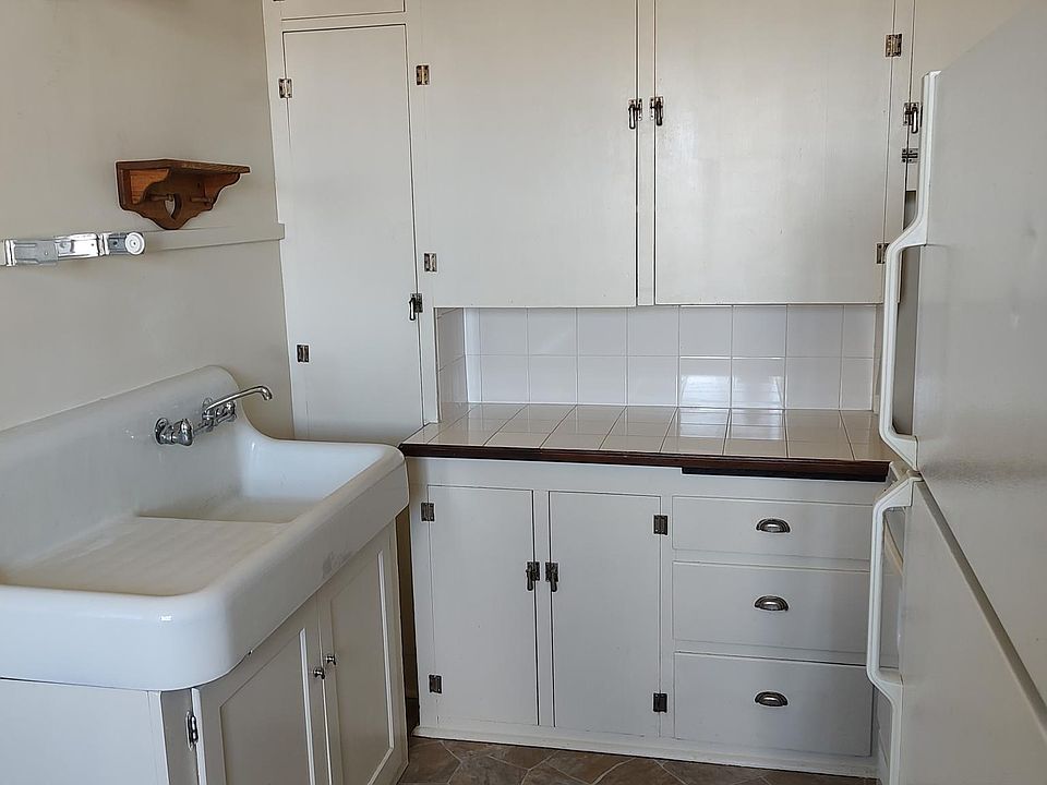 Kitchen with full size appliances and farm sink.