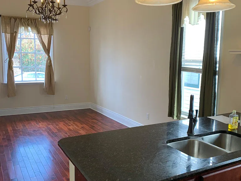 10-foot ceilings and hard wood floors throughout the entire property; apartment now painted light grey