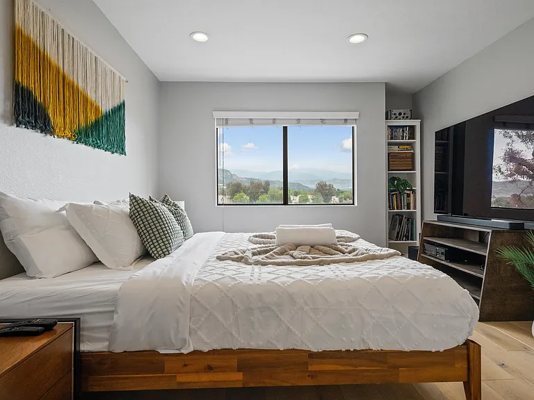 With its serene atmosphere and stylish design, this bedroom is a sanctuary of comfort and relaxation.