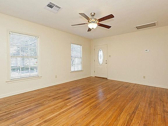 Walking into the living room you will notice this welcoming, bright, open room with its tons of natural light