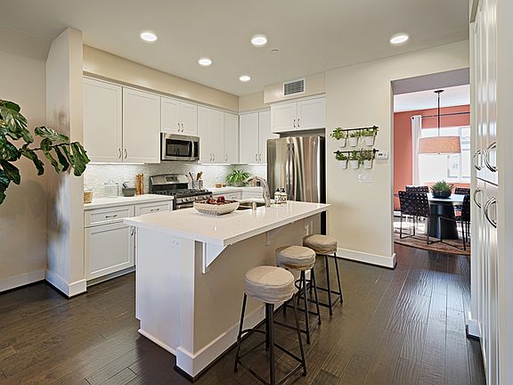 Quartz Counters, Shaker-Style Cabinets, Under Cabinet Lighting, Designer Backsplash and more