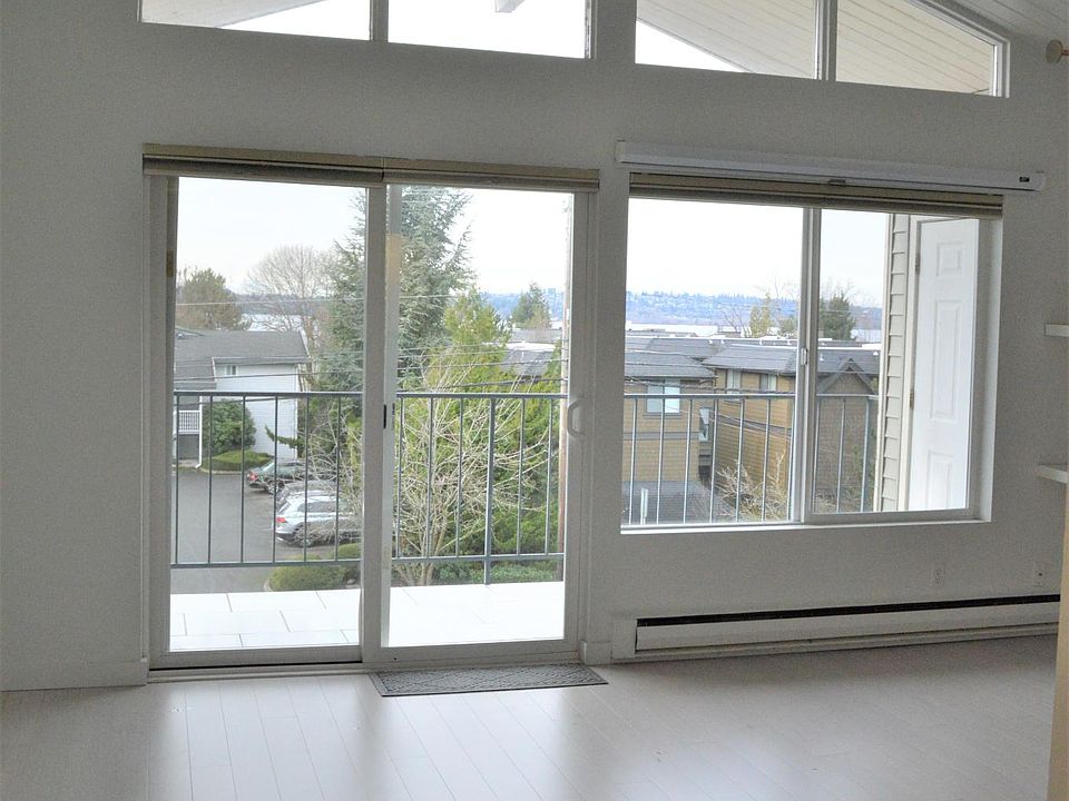 View of living/dining room with beautiful views of Lake Washington