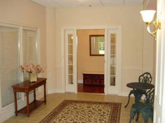 Private, over-sized patio welcomes you to this luxury executive condo