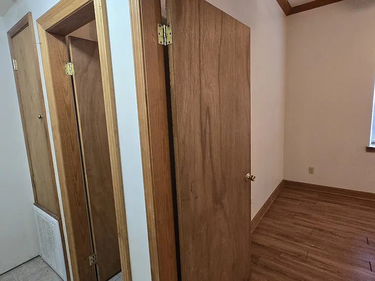 Hallway connecting bedroom and laundry room