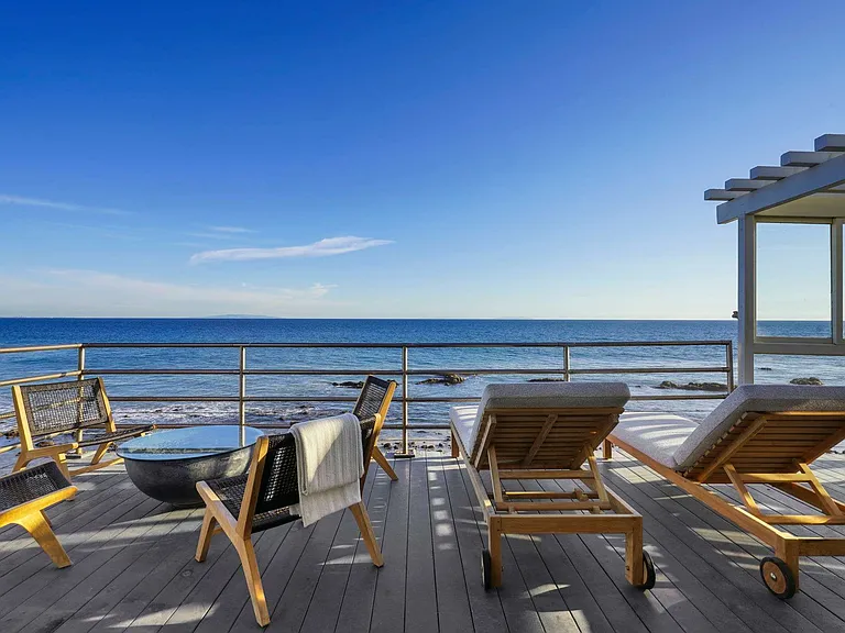 Imagine mornings with coffee in hand, overlooking endless ocean waves.