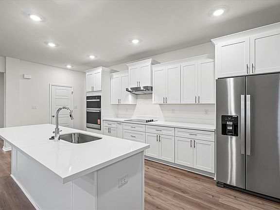 Kitchen in the Brooks floorplan at a Meritage Homes community in Gulfport, MS.