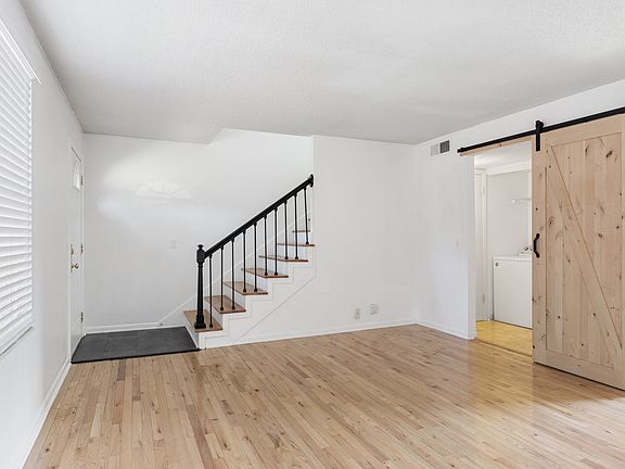 Entry, living area, barn door to laundry and half bath.