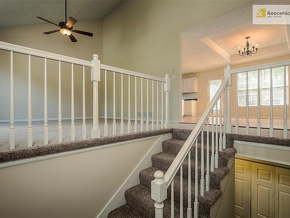 Family room to the left with new carpet.