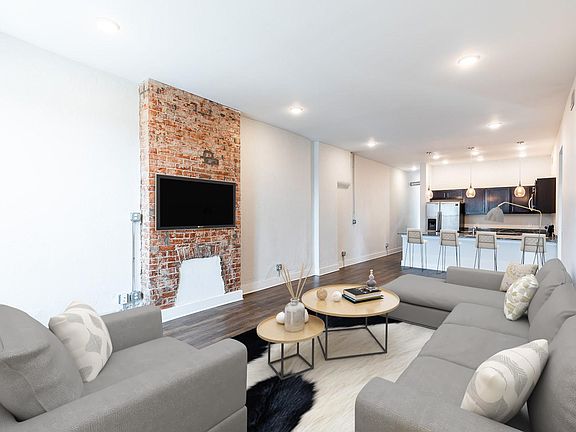 Spacious great room offers enough area for a couple seating areas or dining and seating.