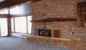 LR brick wall w/fireplace, hearth, 