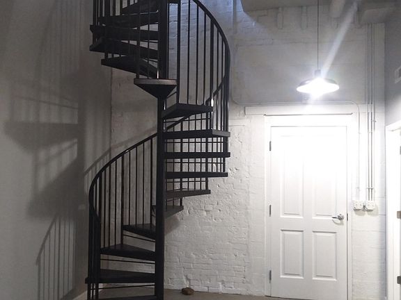 Entry way with beautiful staircase leading to the two bedrooms on 2nd level.
