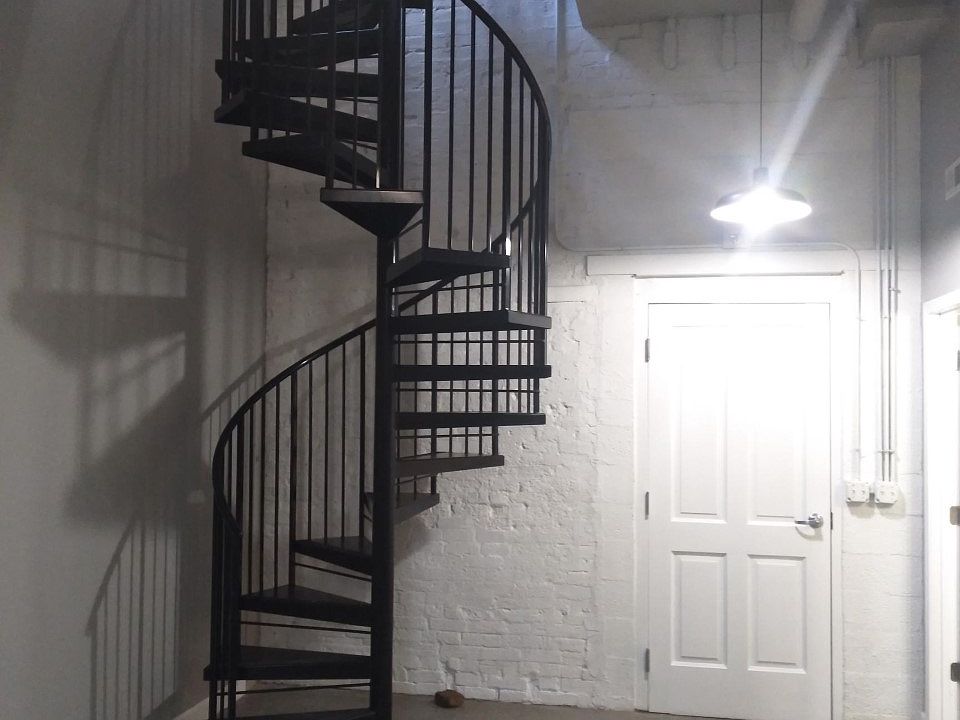 Entry way with beautiful staircase leading to the two bedrooms on 2nd level.