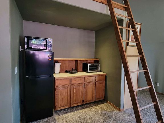 Kitchen area...Refrigerator, microwave, hot pad & air fryer. A lot of storage and room for more.