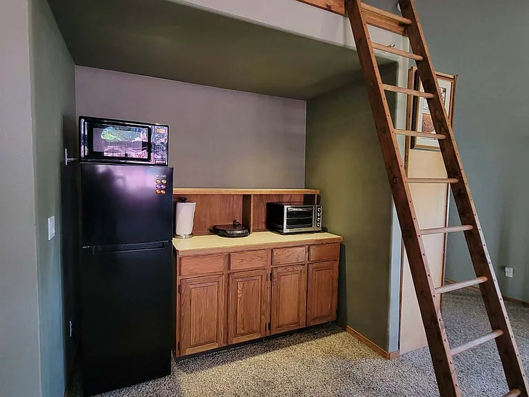 Kitchen area...Refrigerator, microwave, hot pad & air fryer. A lot of storage and room for more.
