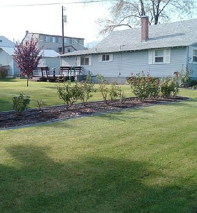 Garage, Concrete Parking Pad, Lrg Deck and  2 Sheds in Back