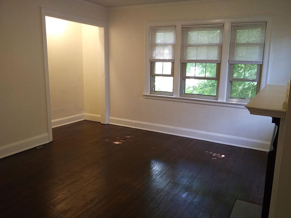 Opposite corner of living room/bedroom, converted Murphy bed closet is wide enough to fit a queen sized bed.