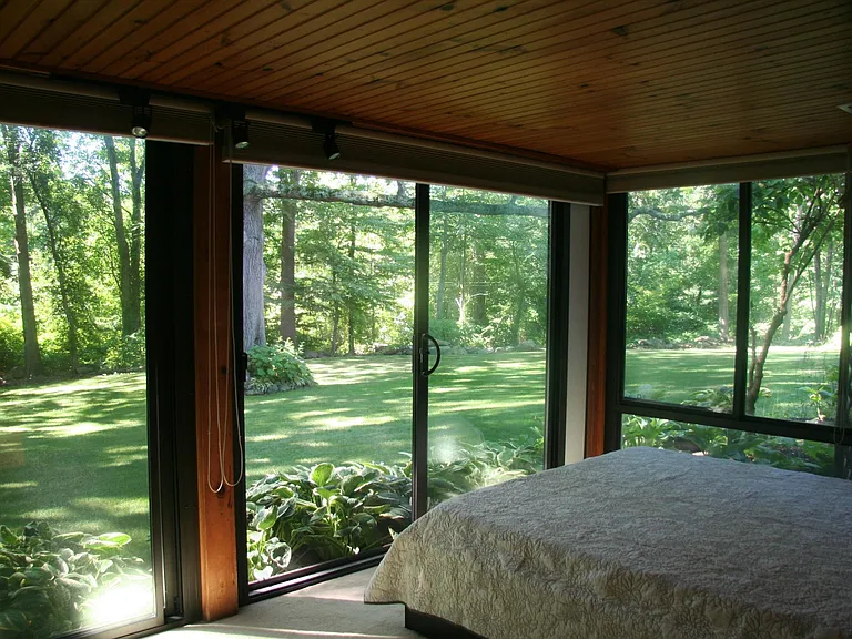 Bedroom looks out onto a palatial backyard with old growth oaks, perennials, wild birds, chipmunks, rabbits & deer.
Full size platform bed has deep drawers for bedding. Windows and sliders are equipped with insulating & room darkening blinds.