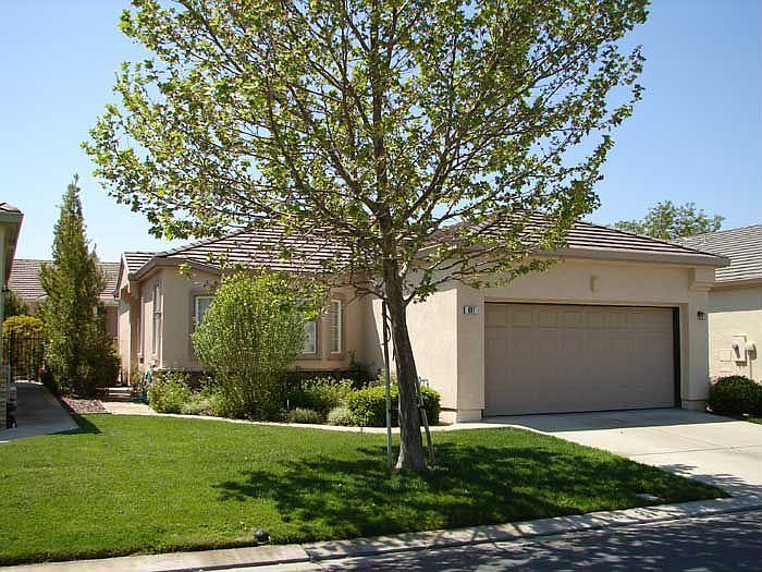 front of home, note beautiful shade tree