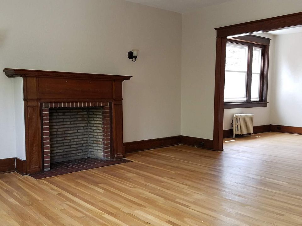 Entry area, living room with fire place leading into the dining room.