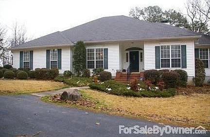 13003 Bart Moreland on 5 Acres
						:
						Great curb-side appeal and beautiful landscaping around a circle driveway.