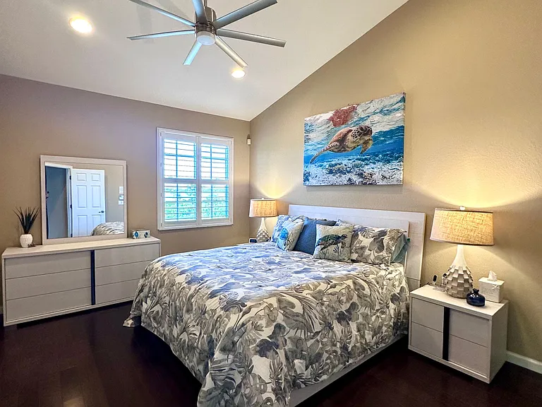 Comfortable, spacious primary bedroom with king bed