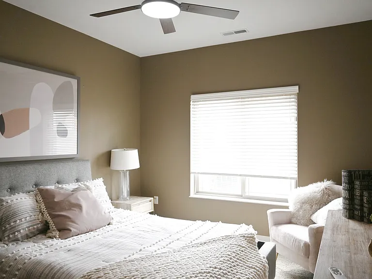 Staged bedroom in model unit at The Sterling.