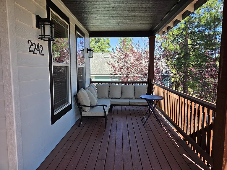 Front porch deck with patio sofa set.