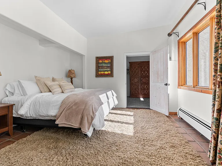 Master Bedroom with walk in closet, ensuite bathroom, and dedicated office