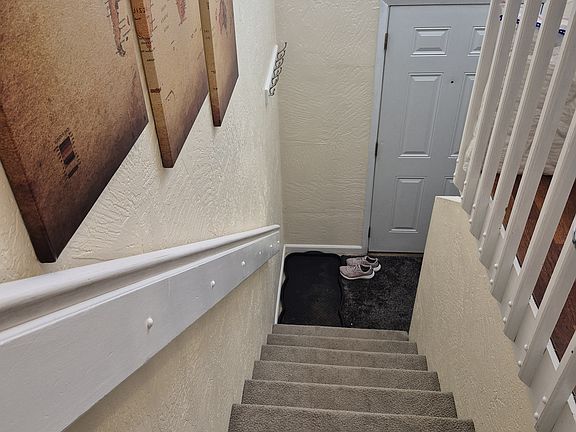 View from the top of the stairs to front door