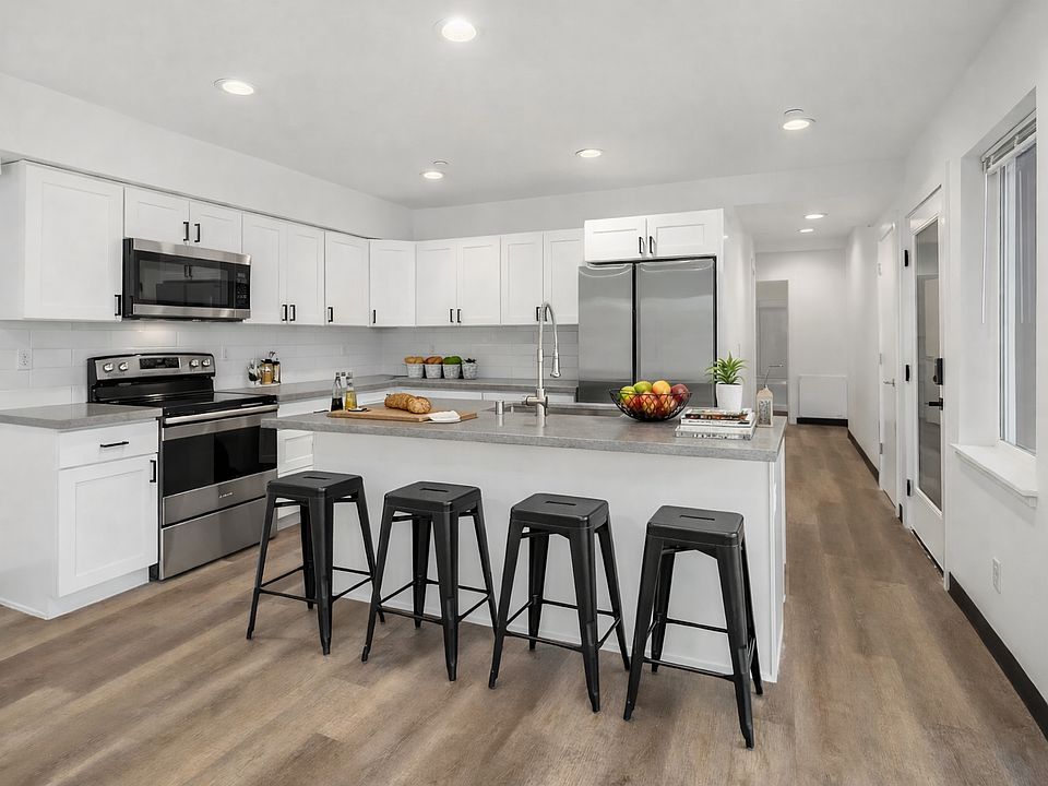Kitchen comes furnished with barstools, pots, pans, cups, glasses, plated, utensils, small appliances, etc.