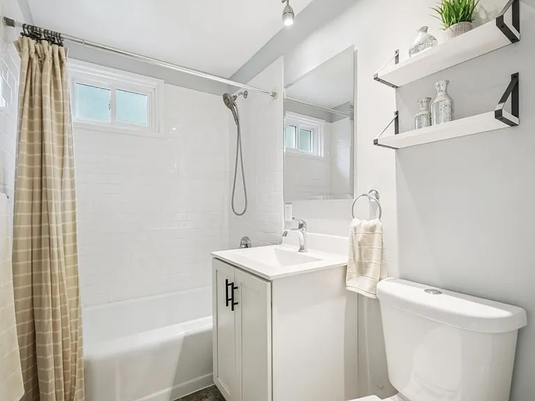 main floor bathroom with bath and shower