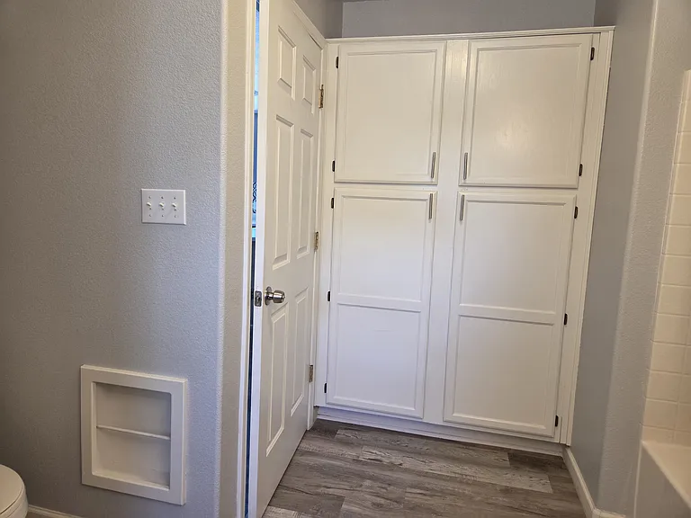 Additional large storage closet inside the second bathroom.