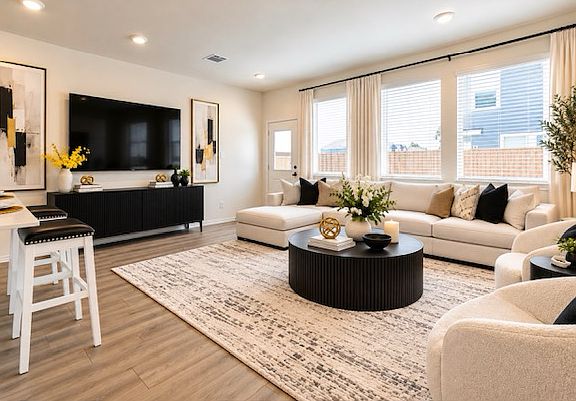 Bright, spacious living room with generous windows and effortless entertaining flow. Virtually Stage
