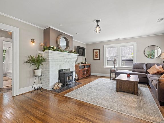 Decorative fireplace, 50 inch tv and sectional leather sofa.