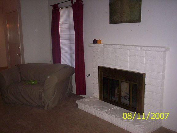Cozy brick fireplace in living room